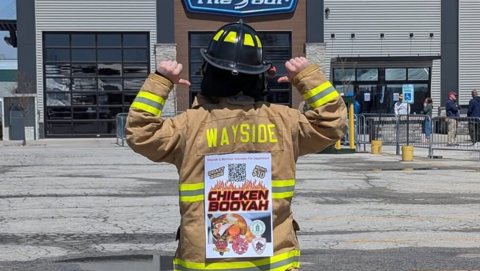 Wayside volunteer firefighter promotes a booyah sale fundraiser during the NFL Draft
