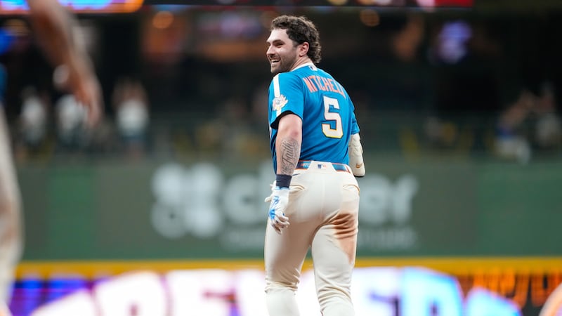 Milwaukee Brewers' Garrett Mitchell reacts to hitting a walk-off RBI single allowing Jackson...