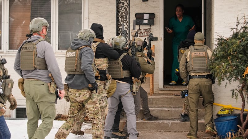 Teyana Gibson Brown, second from right, wife of Garrison Gibson, reacts after a federal...