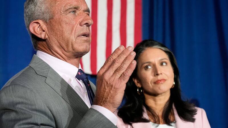 Former Independent candidate for president Robert F. Kennedy, Jr., left, answers a question...