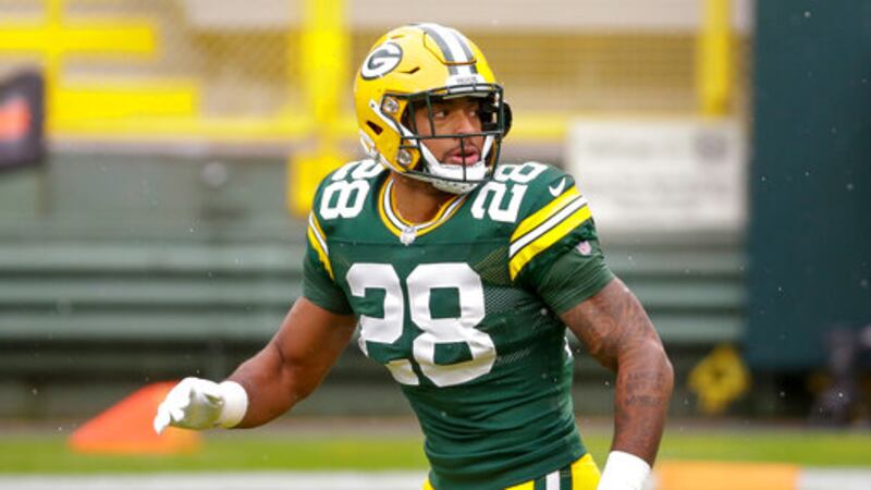Green Bay Packers' A.J. Dillon runs before an NFL football game against the Minnesota Vikings...
