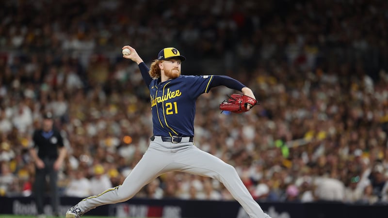 Milwaukee Brewers starting pitcher Dustin May throws during the first inning in Game 3 of...