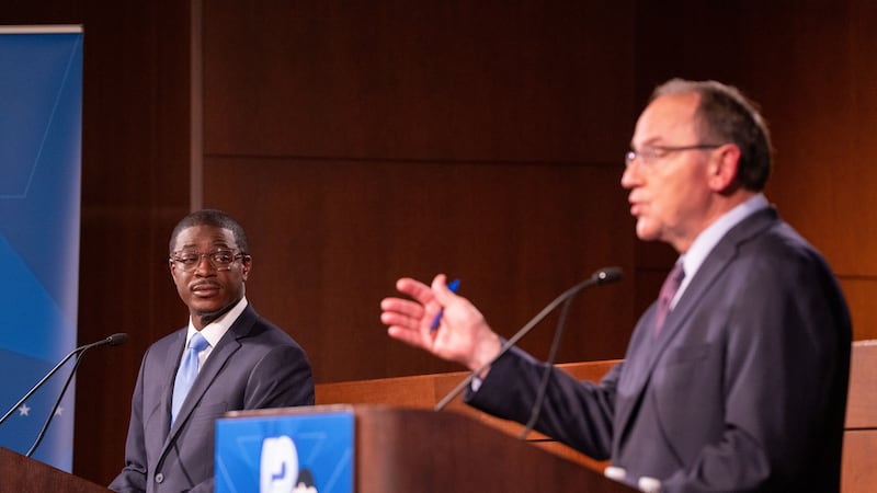 Wisconsin Democratic gubernatorial nominee David Crowley, left, listens as Wisconsin...