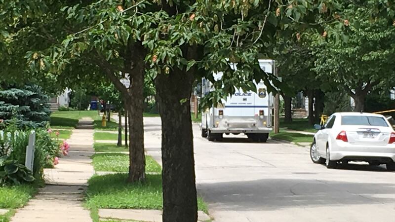 Green Bay Police crime scene unit van parks on Christiana Street while police investigate...