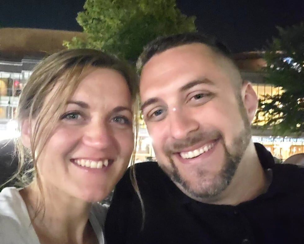 This undated photo provided by Joey Amor shows Nicole Amor, left, and Joey Amor smiling for a...