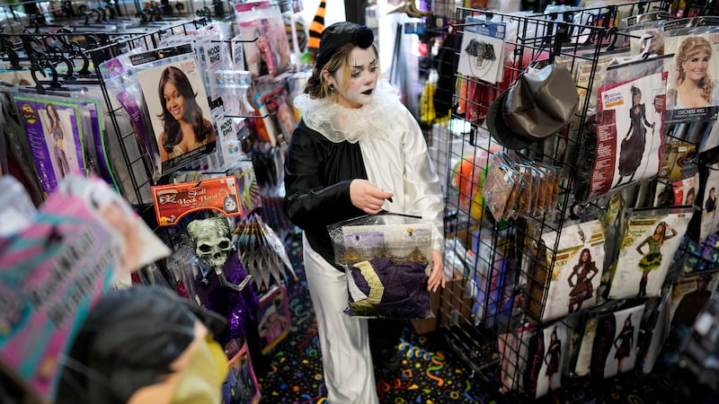 Halloween costume shopping (AP Photo/Charlie Neibergall)