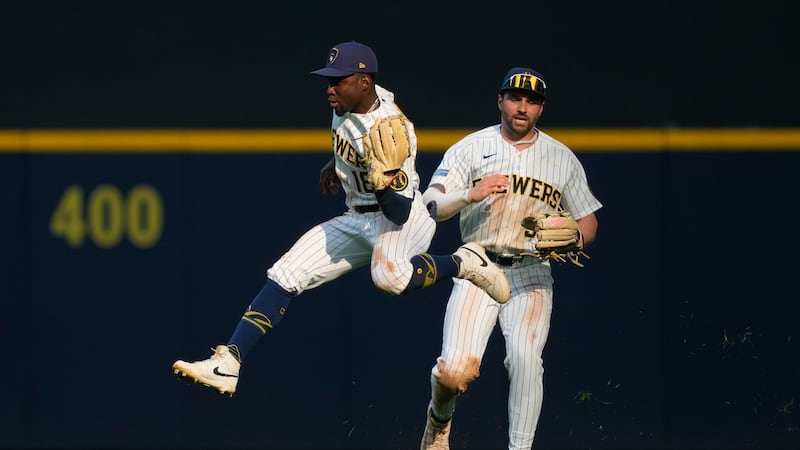 Milwaukee Brewers center fielder Luis Lara (18) makes a running catch in front of center...