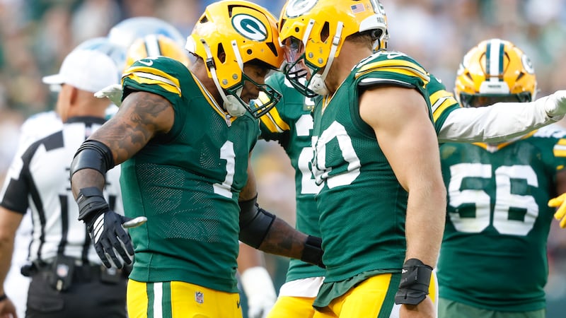 Green Bay Packers defensive end Lukas Van Ness (90) reacts with Micah Parsons during a NFL...