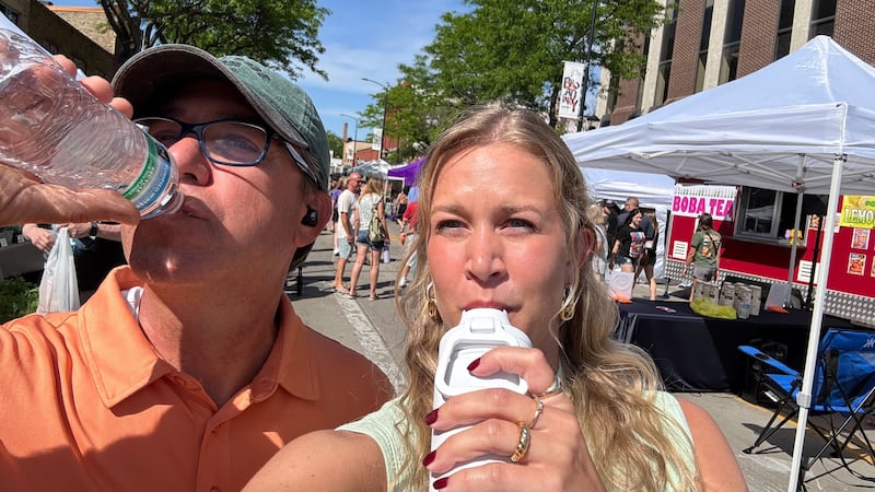 Reporter Taylor Ziebell and Photojournalist Don Johnson staying hydrated during the hot summer...