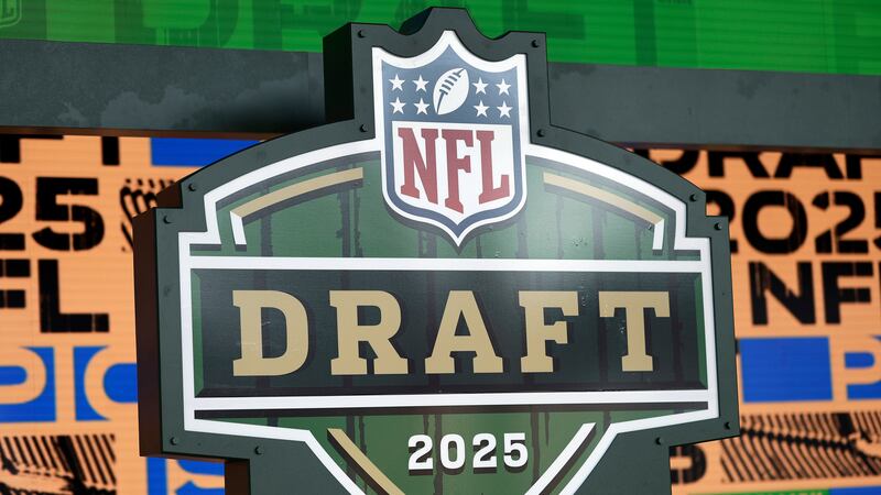 Draft logo on stage ahead of the NFL football draft Wednesday, April 23, 2025, in Green Bay,...